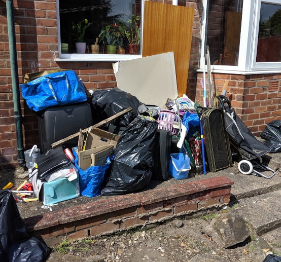 Rubbish piled high at a Birmingham house clearance. Rented property cleared thoroughly by Cleansweep House Clearance.